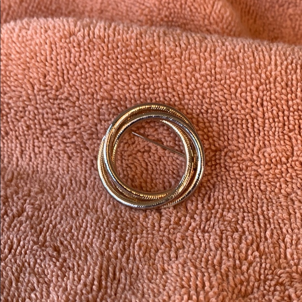 Gold toned circle pin